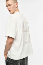 T-shirt bianca over con ricami