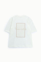 T-shirt bianca over con ricami