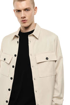 Camicia beige con tasche