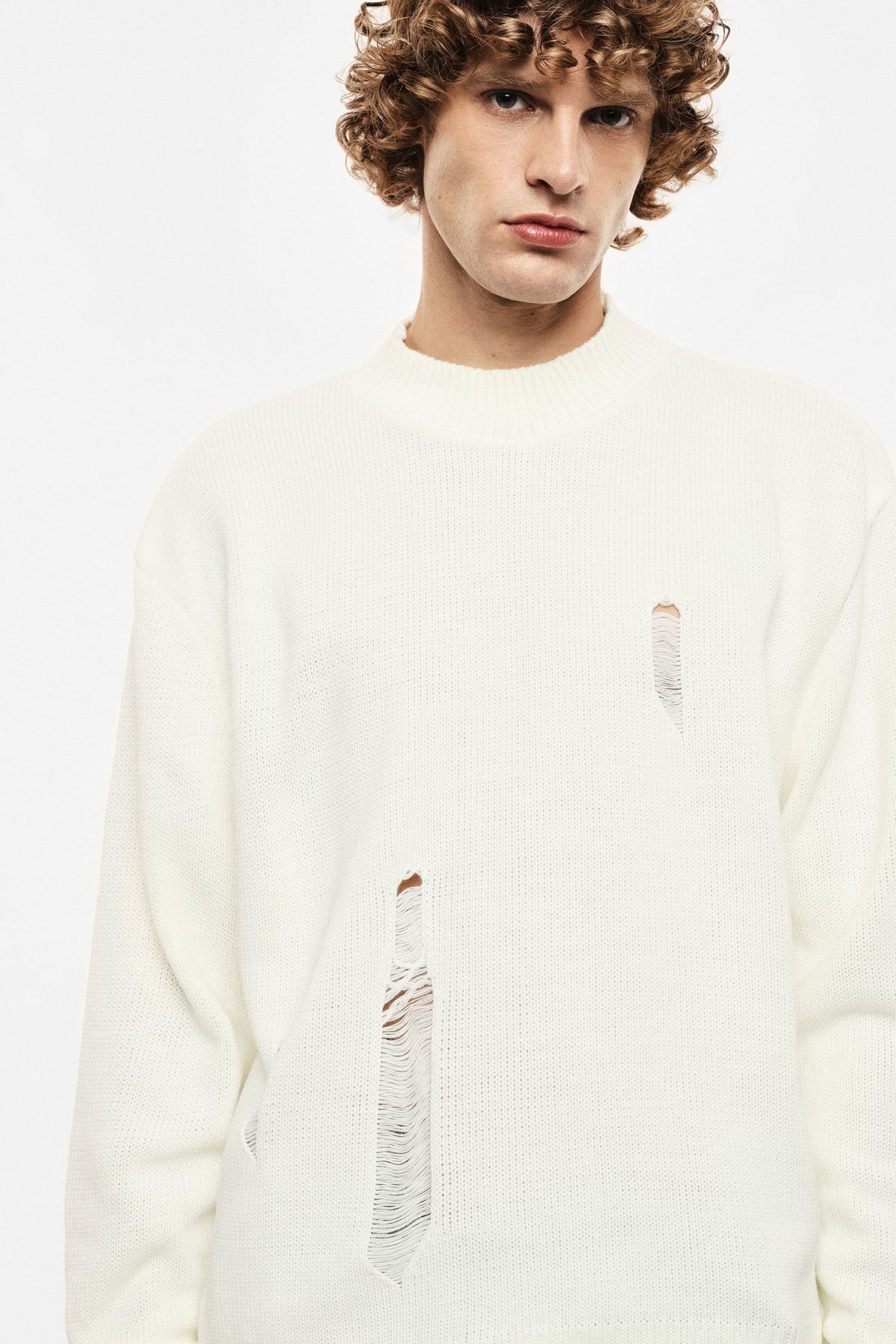 Maglione panna con rotture