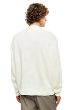 Maglione panna con rotture