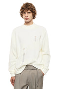 Maglione panna con rotture