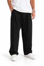 Pantalone nero con pences fondo largo